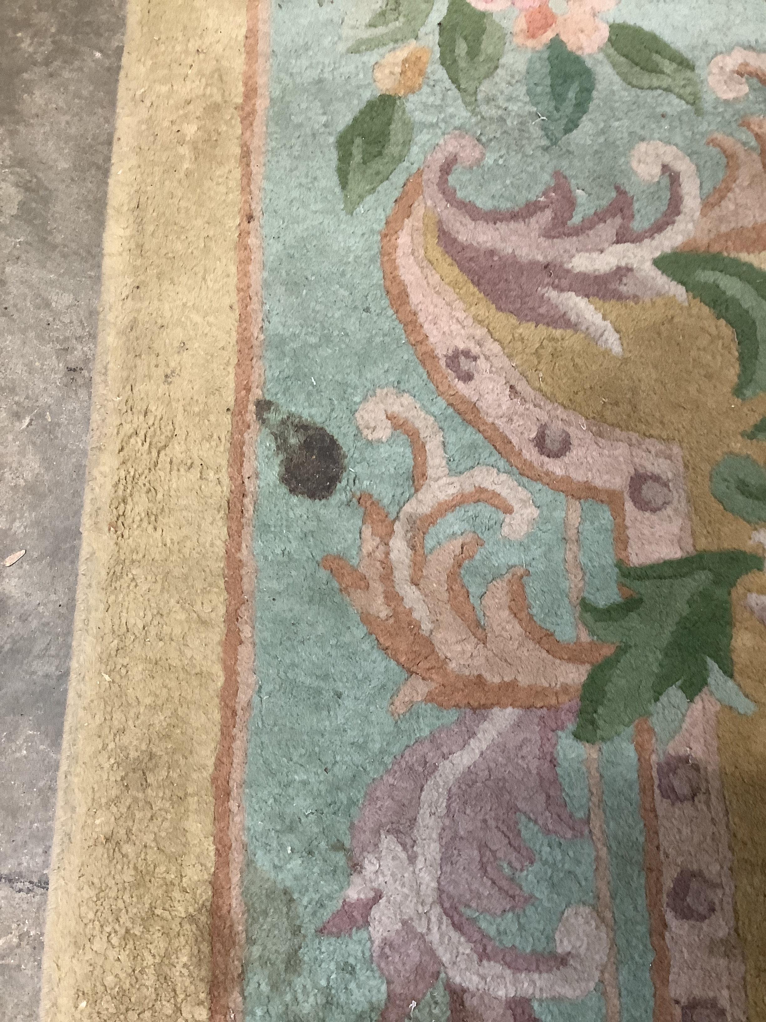 A Chinese gold ground carpet, 360 x 270cm